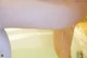 A close up of a person taking a bath in a bathtub.