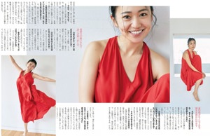 A woman in a red dress is posing for a magazine.