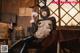 A woman in a bunny costume sitting on a table.