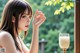 A woman holding a glass of milk in front of a window.